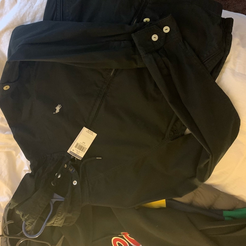 Brand new black polo jacket.